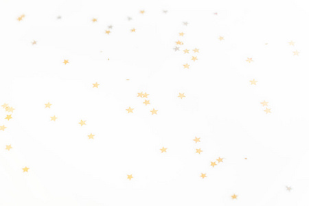 圣诞节金色五彩纸屑星星隔离白色背景