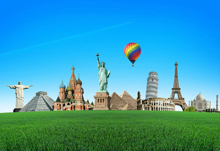 世界的吸引力与草地上的绿色领域的彩色气球。旅行和职业的概念。旅行.世界奇观。环游世界