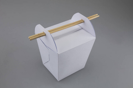 用筷子夹起食物锅盒图片