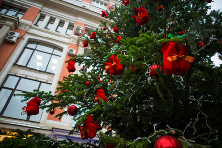 s tree, decorated with golden and red balls, beads and tinsel