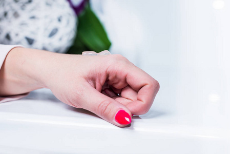 s hand on a table with a gel. She rubbed her hands, taking care 