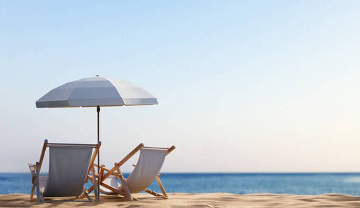 海滨沙滩上带伞的躺椅