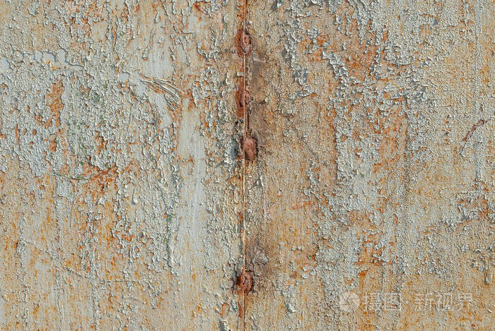 在铁的表面纹理背景上的油漆脱落处
