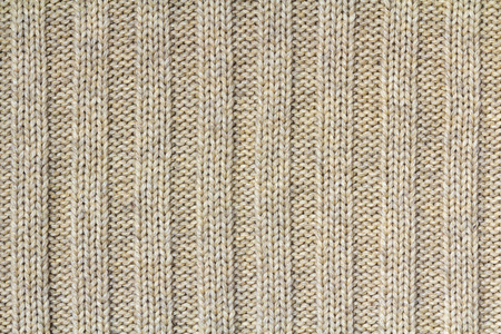 库托的米色花纹针织面料的背景纹理照片