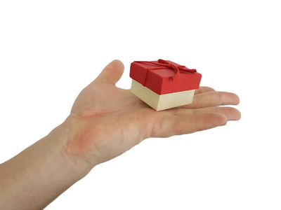 s hand holds a gift box isolated