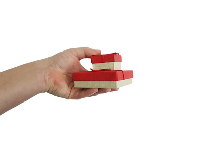 s hand holds a gift box isolated