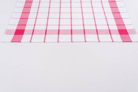 检查在一个红色和白色的笼子在纹理表面的桌布, 从上面的看法