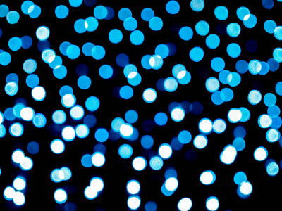 蓝色模糊的Bokeh光离焦背景和纹理圣诞新年假期和庆祝背景