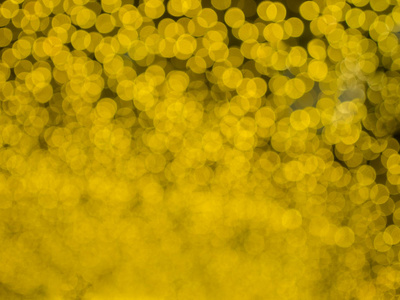 金黄色模糊的bokeh光离焦背景和纹理圣诞新年假期和庆祝背景