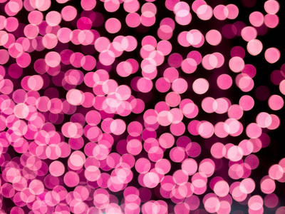粉红色模糊的波克光离焦背景和纹理为情人节圣诞节新年假期和庆祝背景