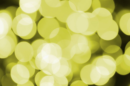 波克效应金黄色离焦光背景。 圣诞灯概念