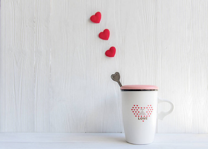 s Day with white cup coffee red heart row on the cup, wood white