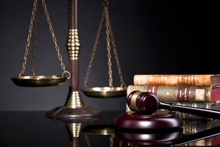 s Gavel and scales of justice and book background.Law concept. L