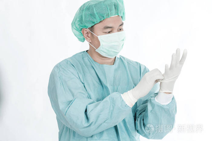 中国外科医生在40年代中期用口罩,发帽,手套,外科医生布隔离成白.