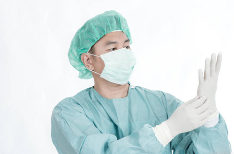 中国外科医生在40年代中期用口罩,发帽,手套,外科医生布隔离成白色.