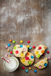 s cookies with colorful chocolate sweets in sugar glaze on a bro