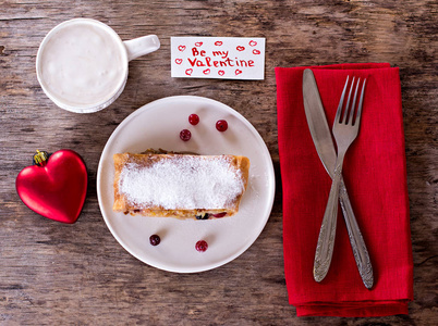 s Days decor. Strudel pie with  cranberries and powdered sugar