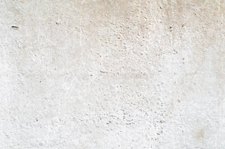 有裂缝和孔洞的水泥灰墙的纹理