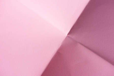 背景用折叠粉色纸的特写镜头图片