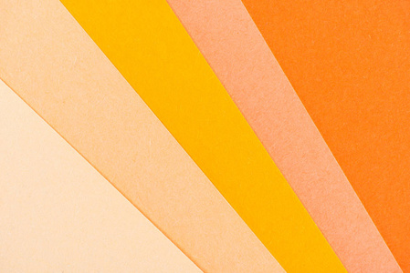 背景的橙色阴影纸层特写镜头照片