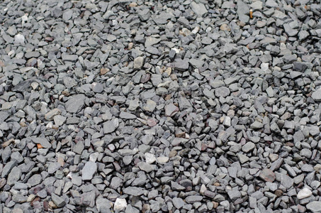砾石和碎石的灰色人行道的纹理