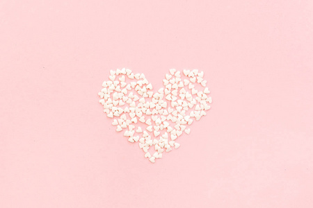 s Day composition. Heart on pale pink background. Flat lay, top 
