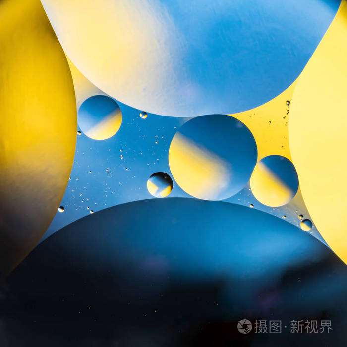 混合水和油美丽的颜色抽象背景基于圆和椭圆形宏观抽象