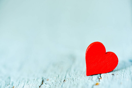 s Day. Heart on a wooden background