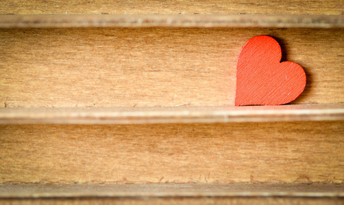 s Day. Heart on a wooden background