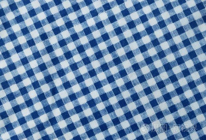 面料纹理接近蓝色和白色伐木工人格子毛巾或餐巾纸图案背景