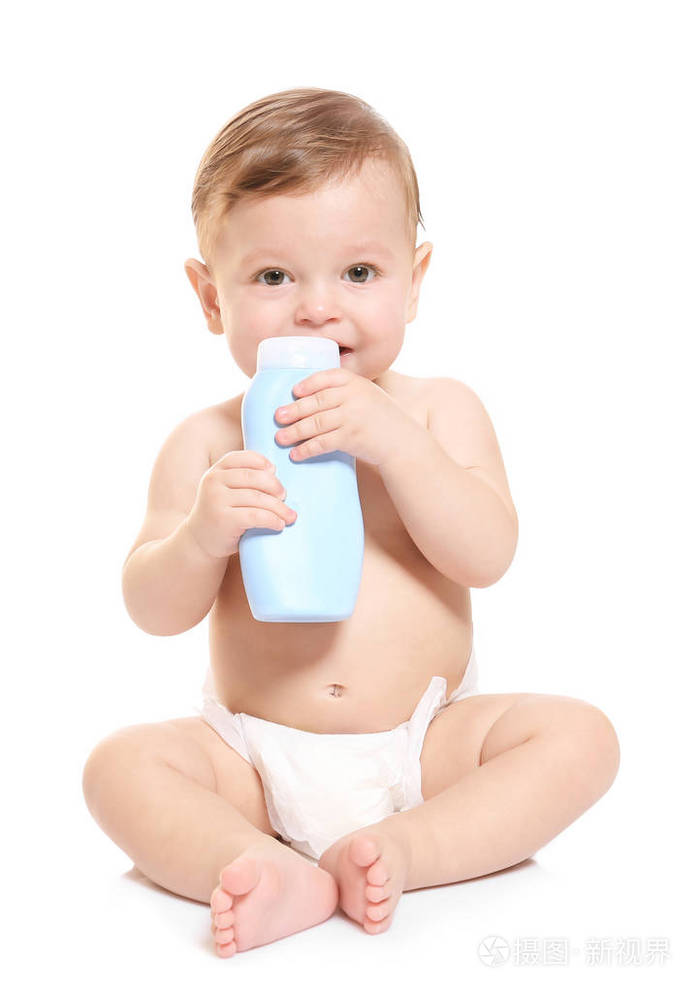 可爱的婴孩与瓶身体奶油在白色背景