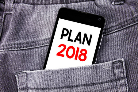 概念手写文本标题显示计划2018。规划战略行动计划的商业概念在后面裤子口袋里写手机与拷贝空间