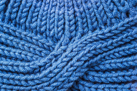 蓝色针织背景。针织质地。针织样品