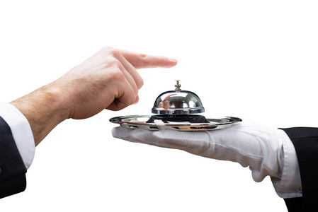 s Hand Ringing Service Bell Held By Waiter On White Background