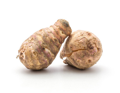 lambchoke两个菊芋块茎,一个裂在白色背景,甜脆的顶鼓上照片