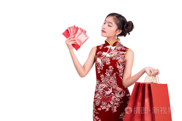 年轻的亚洲美女女子身穿旗袍, 在中国春节联欢晚会上, 在孤立的白色