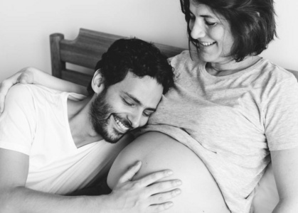 s belly and lying on bed, black and white  