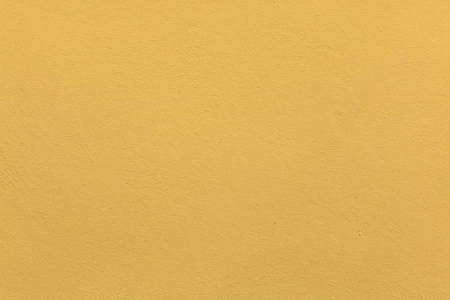 黄赭色灰泥墙漆成黄色的赭石照片