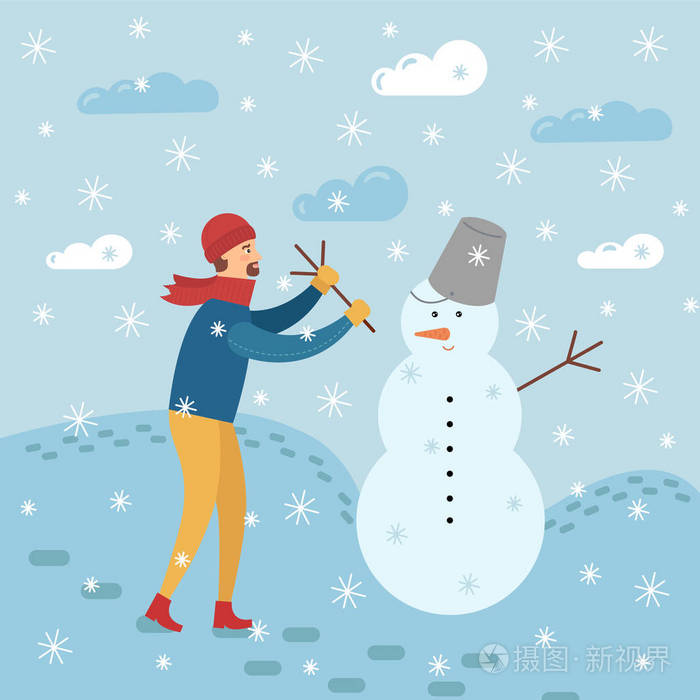 快乐的年轻人在暴风雪中雕刻雪人.