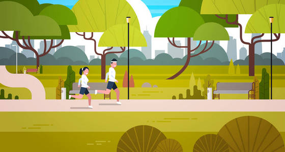 年轻夫妇在户外慢跑在现代公共公园