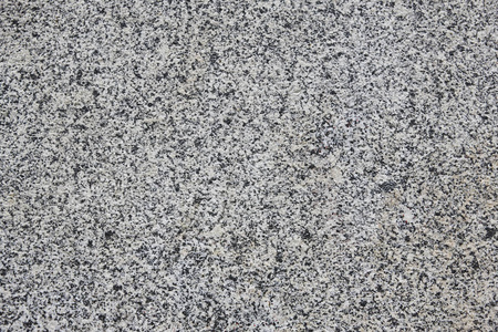 花岗岩墙壁花岗岩纹理表面细节.墙壁和桌面背景照片