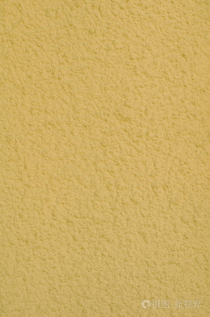 一种黄色灰泥涂层和油漆的背景，水泥和混凝土墙面纹理装饰涂层的外部粗铸