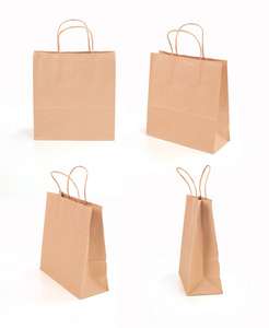 四棕色纸袋子在白色背景图片
