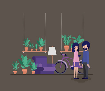 夫妇在客厅与植物和自行车
