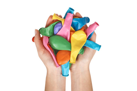 橡胶空气气球为 celebreting, colorfull 党装饰在手。在白色背景上被隔离