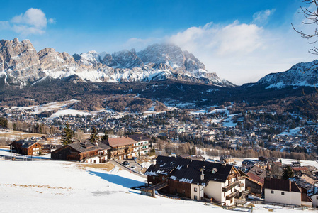 Ampezzo panoramic aerial view at day time with snow.