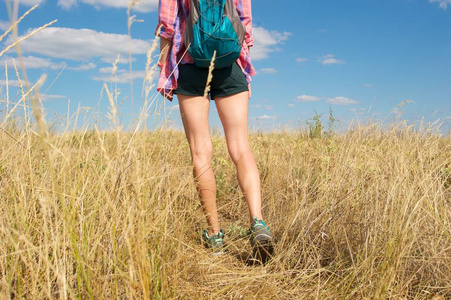  wearing short shorts, plaid shirt and matching color trekking s