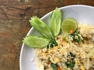  egg and vegetable in white dish serve with slide cucumber on wo