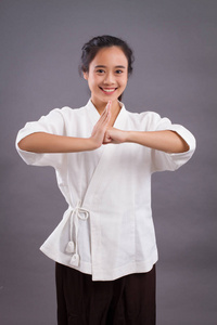  asian woman practicing chinese martial arts, kungfu, taichi, ta