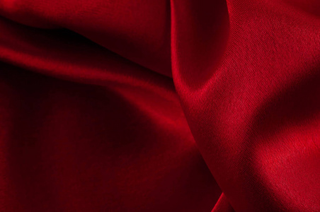 红布质地抽象的丝绸豪华背景,一块布,深红蓝布的纹理螺旋水纹理深红黄